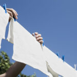 white-laundry-hanging-string-outdoors